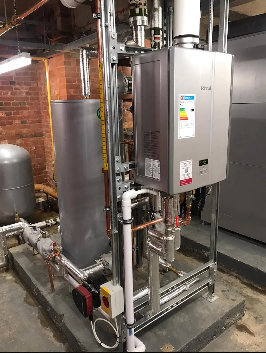 Modern boiler and water heater installation setup.